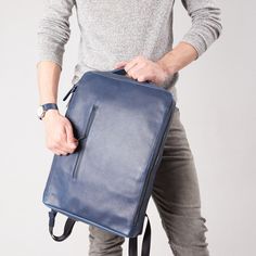 Saola Leather Laptop Backpack · Navy by Capra Leather Modern Backpack With Adjustable Strap For On-the-go, Modern Rectangular Travel Accessories For Commuting, Modern Laptop Bag With Adjustable Strap For School, Versatile Rectangular Leather Backpack With Luggage Sleeve, Laptop Backpack With Adjustable Strap For On-the-go, Modern Travel Accessories Backpack With Zipper Pocket, Versatile Laptop Backpack With Adjustable Strap, Business Laptop Backpack With Adjustable Strap, Versatile Backpack With Detachable Strap For Business