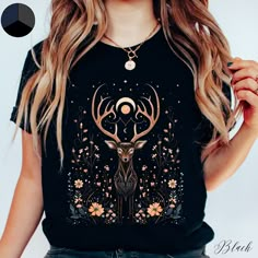 Mystical Deer Unisex Tee Shirt | Cottagecore Fairycore Clothes | Forest Animal Graphic Tshirt | Boho Tshirt ✔️ Soft, light and comfortable unisex short sleeve tee ✔️ 100% Airlume combed and ringspun cotton (fiber content may vary for different colours*) ✔️ Light fabric (4.2 oz/yd² (142 g/m ✔️ Retail fit 📏 Runs true to size ✔️ Dual side seams for structural support of the garment help hold its shape longer ✔️ Ribbed knit elastic collars to bolster shaping, twill taped shoulders to prevent stretc Tshirt Designs Aesthetic, Modern Viking Woman, Animal Cottagecore, Forestcore Aesthetic, Fairycore Clothing, Moon And Flowers, Nature Clothing, Boho Tshirt, Modern Viking