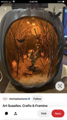 there is a pumpkin with an image of people in the woods on it and lights inside