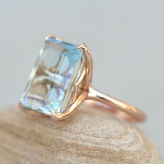 This Emerald Cut Aquamarine Ring is part of our Lily Collection, which features a stunning center stone held by Lily Flower Petal Prongs!

Center Stone: Genuine AAA Bright Blue Aquamarine, Emerald Cut, averaging 14x10mm and 6.75 carats.

All shapes, sizes and gemstones available upon request!

See what’s included with each purchase!



Your browser does not support the video tag. Vintage Aquamarine Engagement Ring, Emerald Cut Aquamarine Diamond Ring With Center Stone, Emerald Cut Aquamarine Rings With Gemstone Accents, Formal Emerald-cut Aquamarine Diamond Ring, Blue Emerald-cut Aquamarine Diamond Ring, Emerald-cut Aquamarine Rings For Gift, Emerald Cut Aquamarine Ring, Engagement Wishes, Ring Settings