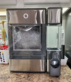 a water dispenser sitting on top of a counter