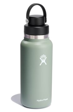 the hydro flask water bottle is green and has a black cap on it's lid