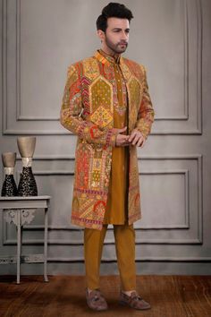 Get ready to steal the show with our Mens Sherwani- S10-S07! This multi-colored open jacket sherwani is the perfect blend of traditional and modern styles. You'll be turning heads with its unique and vibrant design - definitely a vibe! Designer Long Sleeve Sherwani For Festivals, Bollywood Style Sherwani With Long Sleeves, Designer Nehru Jacket For Festivals, Designer Traditional Wear With Naqshi And Long Sleeves, Designer Fitted Traditional Wear In Jamawar, Designer Long Sleeve Kurta With Dupatta, Designer Multicolor Nehru Jacket With Zari Work, Designer Long Sleeve Bandhgala With Naqshi, Fitted Nehru Jacket With Naqshi Straight Kurta