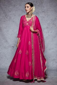 Rani pink anarkali highlighted with floral embroidery, V-neckline and gathers at the yoke. Comes with a churidar and a dupatta. - Aza Fashions Rani Pink Anarkali Suit, Mehendi Dresses, Floral Anarkali, Anarkali Designs, Anarkali Churidar, Pink Anarkali, Rani Pink, Embroidered Anarkali, Anarkali Dress Pattern