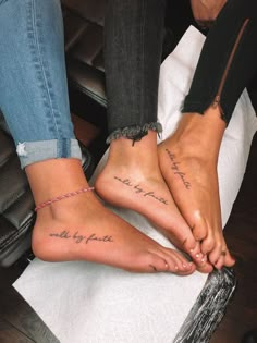 two people with matching foot tattoos on their feet