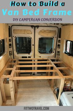 an rv bed frame is built into the back of a camper van for storage