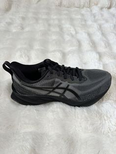 Step up your running game with these ASICS Novablast 3 LE sneakers. Designed with a low top shoe shaft style and lace-up closure, they provide a comfortable and secure fit during your outdoor or city runs. The black mesh upper material offers breathability and durability, while the foam insole material ensures a cushioned feel with every stride. These athletic sneakers are perfect for activewear or casual occasions, and with their classic and sports-themed design, they're sure to become a favorite in your shoe collection. Make them yours today, and experience the exceptional performance and activity they provide. Asics Mesh Running Shoes For Streetwear, Asics Low-top Mesh Sneakers, Asics Sneakers With Laces For Jogging, Black Trail Running Shoes For Light Sports, Gray Lace-up Running Shoes For Training, Asics Mesh Sneakers For Jogging, Dynamic Low-top Trail Running Shoes With Laces, Black Mesh Asics Sneakers, Asics Sneakers For Jogging With Branded Insole