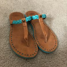 Ugg Flip Flops With Turquoise Details! Never Worn Outside, In Like-New Condition. Perfect For The Summer And Beach! Casual Flat Turquoise Sandals, Casual Turquoise Flat Sandals, Casual Turquoise Open Toe Sandals, Casual Blue Flip Flops, Casual Turquoise Slip-on Sandals, Blue Leather Casual Flip Flops, Casual Blue Leather Flip Flops, Blue Leather Flip Flops For Vacation, Turquoise Leather Sandals For Beach