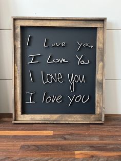 a sign that says i love you in cursive writing