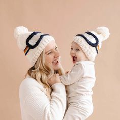 The perfect beanie for little skiers and non-skiers alike. The Blueberry Hill's cream-colored ski hat features a navy, cinnamon, mustard, and bowie grey goggle band, while the pom-pom and silver metallic details add dimension and design to this epic beanie. 100% hand-knit acrylic; hand wash and lay flat to dry. Baby Skiing, Retro Ski, Ski Hat, Navy Hats, Striped Beanies, Kids Gear, Ski Hats, Hand Knit Hat, Metallic Prints