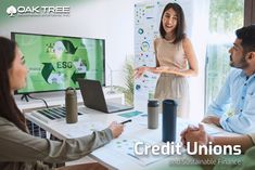 two women and one man having a meeting in front of a computer screen with the words credit unions on it