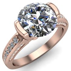 a rose gold engagement ring with an oval cut diamond in the center and side stones