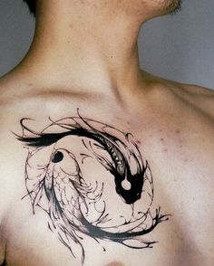 a man with a tattoo on his chest has a bird in the middle of it