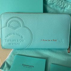 Never Used Return To Tiffany, Tiffany & Co. Zip Wallet Embossed With Silver “2 Peas In A Pod ” Comes With Tiffany And Company, Dust Bag, Tissue Paper, Store Bag And Box! Makes An Amazing Gift For Your Loved One. Tiffany Blue Taurillon Leather One Interior Pocket With Zipper 16 Interior Card Slots Palladium-Plated Zipper Pull Nappa Leather Lining Made In Italy Comes From A Smoke-Free Cat Friendly Home. Tiffany Bags, Return To Tiffany, Paper Store, Free Cats, Fancy Bags, Free Cat, Pocket With Zipper, Tiffany And Co, Cat Friendly Home