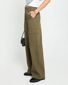 Product Details The Clem Pant offers a relaxed fit and mid-rise for effortless style. The wide leg design provides a cool and comfortable fit, perfect for any casual occasion. With cargo pockets and an olive green color, these pants are both functional and fashionable. - Front button and zipper- Pockets- Lightweight fabric- Content: 100% Cotton; Lining: 80% Polyester, 20% Cotton- Care: Wash cold & tumble dry low Style# C24WPAH02820 Fit Notes - Model wearing a size 2- Model measurements: 5'10'' H