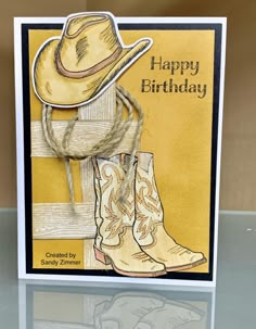 a birthday card with cowboy boots and a hat