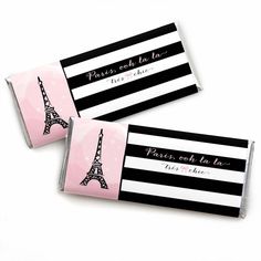 two pink and black candy bars with the eiffel tower in paris on them