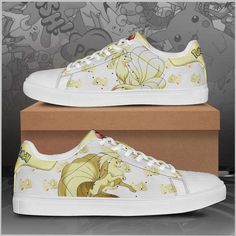 a pair of white shoes with cartoon characters on them