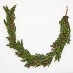 pine cones and evergreen needles hang from a string