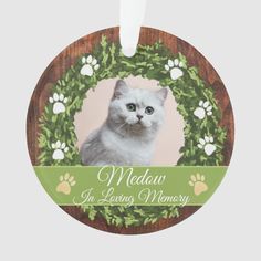 a pet memorial ornament with a photo of a cat