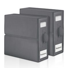 two gray file folders with labels on them