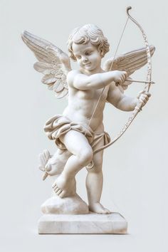 an angel statue with a bow and arrow