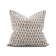 a brown and white pillow on a white background