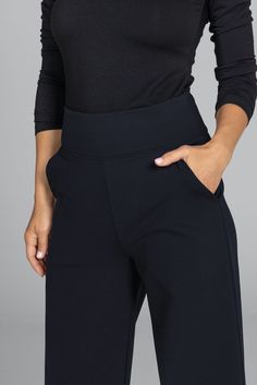 Why we love this: Step into the epitome of grace with our Black Grace Wide Leg Pant. These must-have black dress pants are designed for any occasion. With a super-flattering waist & roomy pockets, you’ll be dashing from desk-to-dinner with ease. Features: KiraGrace PowerStrong: Feels like cotton, keeps you dry High-rise, 32" inseam, Leg Opening: 25" Slimming high waist w/side pockets Made in U.S.A. of imported fabric Waist: High-Waisted (13" Rise) Inseam: 32" inseam, easy to hem For easy alterations - click here Leg Shape: Straight wide leg Sizing: Relaxed fit, size down if in between sizes Compression: Flowy- No compression Model, Kori, is 5'10" and wearing a size small Fitted Workwear Pants With Wide Waistband, Fitted Pants With Wide Waistband For Work, Tailored Black Wide Leg Pants In Elastane, Tailored Black Wide Leg Elastane Pants, Black Tailored Sleek Wide Leg Pants, Elegant Fitted Pants With Wide Waistband, Workwear Bottoms With Wide Waistband, Black Stretch Ankle-length Dress Pants, Elegant Workwear Pants With Wide Waistband