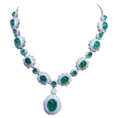 An exquisite design , very glamour and refined, by Italian designer , a very piece of art. Necklace come in 18k gold , with 18 pieces of natural Zambia emeralds, oval cabochon cut, fine quality , of 46,80 total carats. Pendant emerald is of 12,56 carats. Necklace come with natural diamonds of 13 carats,F/VS top quality. On this necklace , pendant is mobile, but on request , I can do fix . It is a high jewelry piece. Handcrafted by artisan goldsmith. Excellent manufacture and quality. Complete with AIG report. Whosale price. Note: on my shipment, customers not pay taxes and duty. Formal White Gold Emerald Necklace With Jewels, Dazzling Jeweled Emerald Necklace For Formal Events, Opulent Round Necklaces For Formal Occasions, Dazzling Formal Emerald Gemstone Necklace, Luxury Emerald Necklace With Jewels For Formal Occasions, Exquisite Jeweled Emerald Necklace For Anniversary, Luxury Emerald Necklace With Jewels For Formal Events, Luxury Emerald Necklace For Formal Events, Luxury Oval Emerald Necklace With Jewels