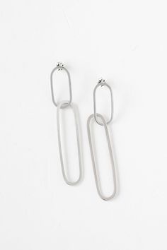 Keep it all together with the timeless style of the paperclip chain link. Handcrafted with careful attention to detail, the Ellipse Collection boasts an eye-catching linked design that is both a statement and lightweight. Classic yet modern, this collection is ageless. Handmade earrings featuring two interlocking metal hoops that create an elegant yet statement-making design. - Sterling silver and vermeil in high polish finish- Oxidized silver in satin finish- About 3" long Cleaning Stone, Double Stud, Hanging Necklaces, Ring Sizer, Oxidized Silver, Everyday Jewelry, Paper Clip, Handmade Earrings, Satin Finish