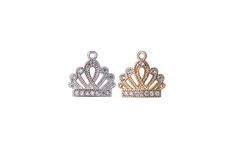 Crown Cubic Zirconia Charm This crown cubic zirconia charm measures 10mm x 9.75mm. Sold by the Piece. Available in Silver & Gold 100% Lead-safe. Nickel-free Hypoallergenic Core Metal: Brass. Care Tips: Do not swim or bathe with this jewelry. Try not to spray perfume or rub lotions on this product as it could mar the finish. To clean, use gentle hand soap and warm water. Pat dry with a paper towel. Do not use jewelry cleaners or a jeweler's cloth. Read more about how to take care of plated jewelr Elegant Silver Diamond Charms, Silver Cubic Zirconia Charms For Anniversary, Elegant White Gold Charms With Cubic Zirconia, Elegant White Gold Cubic Zirconia Charms, Elegant Cubic Zirconia Charms For Jewelry Making, Crown Charm, Spray Perfume, Perfume Spray, Pitcairn Islands