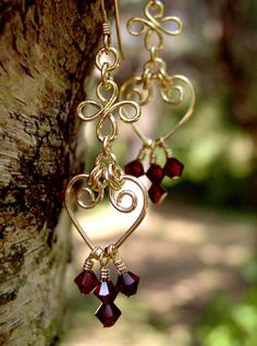 Handmade 14k Gold Filled Chandelier Earrings Genuine Red Garnet Swarovski Crystal Chandelier Earrings. Large enough to be noticed, light enough to wear every day! These Garnet Chandelier Earrings are a just 1,5 Inches long. Every single little gemstone is wire- wrapped one at a time, each pair of earrings take 2 hours to make! We do not just use "pre-made" parts and attach our gemstones, we wire wrap each bead individually and attach them to our custom wire form shapes. We do not import, or mass Recovery Jewelry, Dramatic Earrings, Gold Chandelier Earrings, Bijoux Fil Aluminium, Crystal Chandelier Earrings, Handmade Earrings Beaded, Diy Wire Jewelry, Long Dangle Earrings, Handmade Wire Jewelry