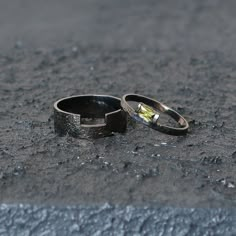 two rings sitting on the ground next to each other