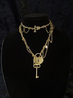 "This beautiful asymmetric necklace is artsy and romantic, but at the same time it's pretty bold and versatile. You can wear it long or wrap it around your neck twice which will place the decorative lock and key toggle clasp on the front and turn your Boho necklace into a Victorian choker. If you want to wear the necklace as a choker please, make sure you select sufficient length before checkout. The necklace you see in all the photos is 31\" (78.8 cm) long. 1\" = 2.54 cm. The key charm is remov Vintage Gold Necklaces With Keys, Vintage Gold Jewelry With Keys, Vintage Gold Key Necklace, Elegant Heart-shaped Necklace With Two Keys, Gold Brass Necklace With Keys, Gold Heart Necklace With Two Keys, Heart Lock And Key, Victorian Choker, Key Charm Necklace