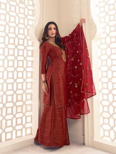 This Malaika Arora Maroon Zari Woven Yoke Design Embroidered Straight Kurta set features true craftsmanship in a luxurious silk blend design. Embellished with intricate Zari, this sharara is perfect for ethnic events and winter parties. Ready-to-wear, it features a round neck and three-quarter sleeves, with side slits for extra comfort. Grandeur and majestic artwork is attributed to this exquisite creation by Malaika Arora. TOP: Silk Blend(Brocade), TOP INNER: Cotton, BOTTOM: Silk Blend(Brocade) Western Kurtis, Brocade Top, Yoke Design, Malaika Arora, Winter Parties, Ethnic Motifs, A Line Kurta, Elegant Sets, Anarkali Suit