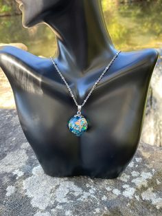 This is a unique blue mixed medium resin orb necklace! I used rainbow translucent pieces, multi color glitter chunks, gold and silver flakes to create this pendant! This necklace is a unique with a lot of shine and different looks from different angles! This would be a great addition to your collection or as a special gift! Check out my page for the matching ring! This pendant comes in two sizes (Medium 1.25 tall by .75 wide) or  (Large 1.50 tall by 1 wide) (Please choose your size at checkout) Blue Nickel-free Crystal Necklace As Gift, Magical Iridescent Jewelry For Gifts, Celestial Resin Jewelry For Gifts, Celestial Resin Jewelry As Gift, Celestial Resin Jewelry As A Gift, Celestial Style Resin Jewelry For Gifts, Iridescent Hypoallergenic Jewelry As Gift, Blue Hypoallergenic Pendant Necklaces, Blue Hypoallergenic Pendant Necklace