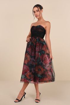 Stunning and sweet, the Lulus Splendidly Yours Black Floral Organza Mesh Strapless Midi Dress is the perfect treat! Shiny floral organza shapes this exceptional dress with a black, sheer mesh overlay that adorns a strapless, ruched bodice with seamed cups and a sweetheart neckline (with hidden no-slip strips). High, fitted waist sits atop a matching skater skirt that falls to a chic midi hem. Hidden back zipper/clasp. Fit: This garment runs small - please size up. Length: Mid-calf length. Size medium measures 38.5" from top to bottom. Bust: Works best for A to C cup sizes - consider sizing up for fuller bust. Waist: Fitted - very fitted at natural waist. Hip: Not Fitted - fuller skirt allows room for hips. Undergarments: May be worn with a strapless bra, adhesive bra, petals, or no bra. Fa Holiday Formal Dresses, Holiday Dresses Women, Christmas Dresses, Eve Dresses, New Years Eve Dresses, Strapless Midi Dress, Autumn Dress, Ruched Bodice, Guest Dress