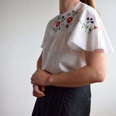 Vintage white embroidered blouse. Great vintage condition. No tags but feels like cotton or cotton mixed with other fibre. Originally women's size S / M depending on desire fit but please check measurements carefully. Two small pockets. One button closure at the back of the collar. Super unique.  Armpit to armpit laying flat 51cm=20' Total length 62cm=24' Model is 64cm=5'4 tall UK size 10. Postage costs are not refundable. Embroidered Cotton Tops For Spring, Summer Cotton Embroidered Crew Neck Top, White Crew Neck Blouse With Floral Embroidery, Vintage Crew Neck Spring Blouse, Vintage Crew Neck Blouse For Spring, Multicolor Embroidered Cotton Shirt For Spring, Spring Cotton Embroidered Crew Neck Top, Vintage Crew Neck Blouse For Summer, Fitted Cotton Embroidered Top With Crew Neck