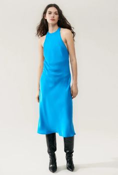 Silk Laundry halter-style dress crafted in 100% silk with a high neckline and a low-cut back. Cut on the bias to a regular fit and a mid-length hemline.- Material: 100% Silk Sandwashed, 16 momme- Care: Hand wash in cold water or dry clean- Matte sheen- Cut on the bias- Mid-length- High halter neckline with button faste Silk Laundry, Halter Style Dress, Dress Crafts, Halter Style, Halter Neckline, High Neckline, Style Dress, Low Cut, Mid Length