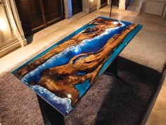 a glass table sitting on top of a carpeted floor