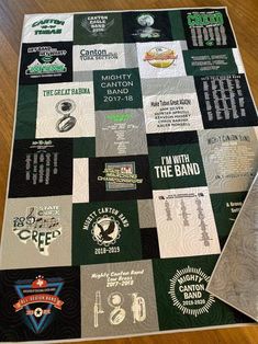 a quilt made to look like it has many different logos on the front and back