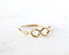 Knotted Ring Gold-Filled | Etsy Gold Infinity Promise Jewelry, Adjustable Infinity Stackable Rings For Anniversary, Adjustable Infinity Stackable Anniversary Rings, Gold Infinity Promise Stackable Rings, Adjustable Gold Infinity Stackable Rings, Dainty Gold Infinity Stackable Rings, Gold Infinity Ring As Gift, 14k Gold Infinity Stackable Rings For Anniversary, Gold Infinity Stackable Rings As Gift