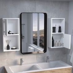 a bathroom with a sink, mirror and shelving unit in the wall above it