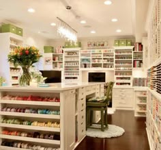 a room filled with lots of different types of crafting supplies on shelves and drawers