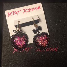 Betsey Johnson - Two-Tone Bow & Crystal Glitter Heart Drop Earrings (Nwt) New. Unused / Unworn With Tags Set In Gold-Tone & Black-Tone Mixed Metal; Glass Plastic: Heart Drop Embellished With Stone Accents And Bow Details Lever Back Closure Approx Drop: 1.3/4” Bj Gift Box Not Included So Sweet & Chic, You’ll Want To Wear These Betsey Johnson Drop Earrings Every Single Day! Matching Necklace Posted Separately. Take Them Both Home! Smoke & Pet Free Environment Cute Party Jewelry With Heart Charm, Cute Heart Charm Jewelry For Parties, Cute Heart Shaped Jewelry For Parties, Cute Heart Charm Party Jewelry, Cute Heart-shaped Jewelry For Party, Cute Heart-shaped Party Jewelry, Cute Jewelry For Valentine's Day Party, Cute Valentine's Day Party Jewelry, Glitter Earrings For Valentine's Day Party