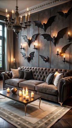 a living room filled with lots of furniture and candles on the wall next to a couch