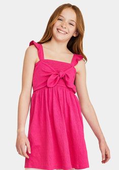 JustFab Pink female Fashion >> Kids >> Girls >> Clothing >> Dresses & Rompers regular Fit: Semi-fitted bodice. Length: Hits above the knee. Fabric: 65% Polyester, 32% Cotton, 3% Spandex. Machine wash cold. Imported. When in doubt, pink is always a good answer! This sweet dress has ruffles at the straps, comfy smocking around the whole bodice, and a faux-tie front for a super-cute look. Smocked Tie Front Dress Playful Pink Smocked Dress For Summer, Playful Pink Smocked Dress With Ruffles, Playful Pink Dress With Smocked Back, Playful Sleeveless Dress With Tie Straps, Playful Sleeveless Smocked Summer Dress, Playful Sleeveless Summer Smocked Dress, Sleeveless Playful Smocked Summer Dress, Summer Sleeveless Playful Smocked Dress, Casual Sundress With Spaghetti Bow Straps