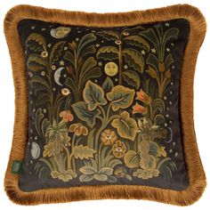 a decorative pillow with an animal and plants on the front, surrounded by stars and moon