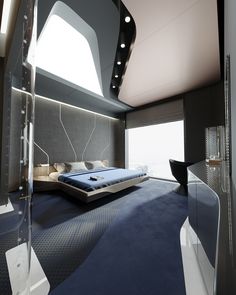 a large bed sitting in the middle of a bedroom next to a tall window on top of a wall