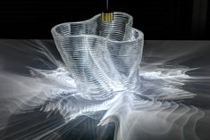 an artistic image of a glass vase with a light shining on it